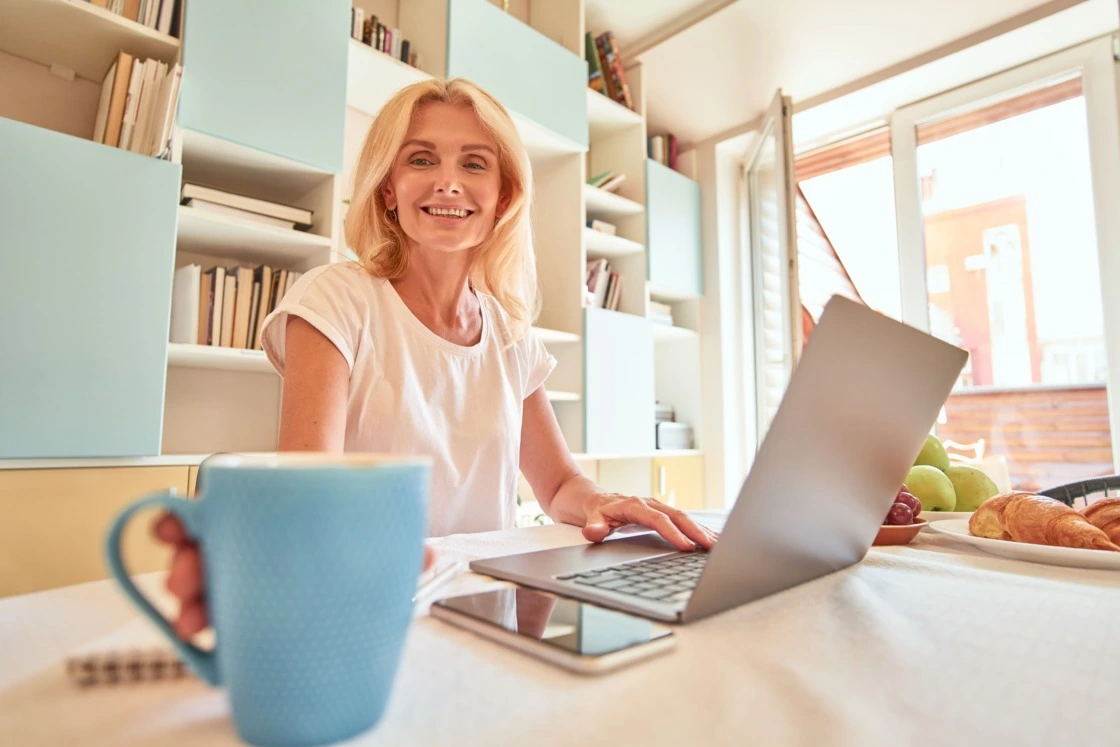 middle-aged-business-woman-smiling how to pay freelancers